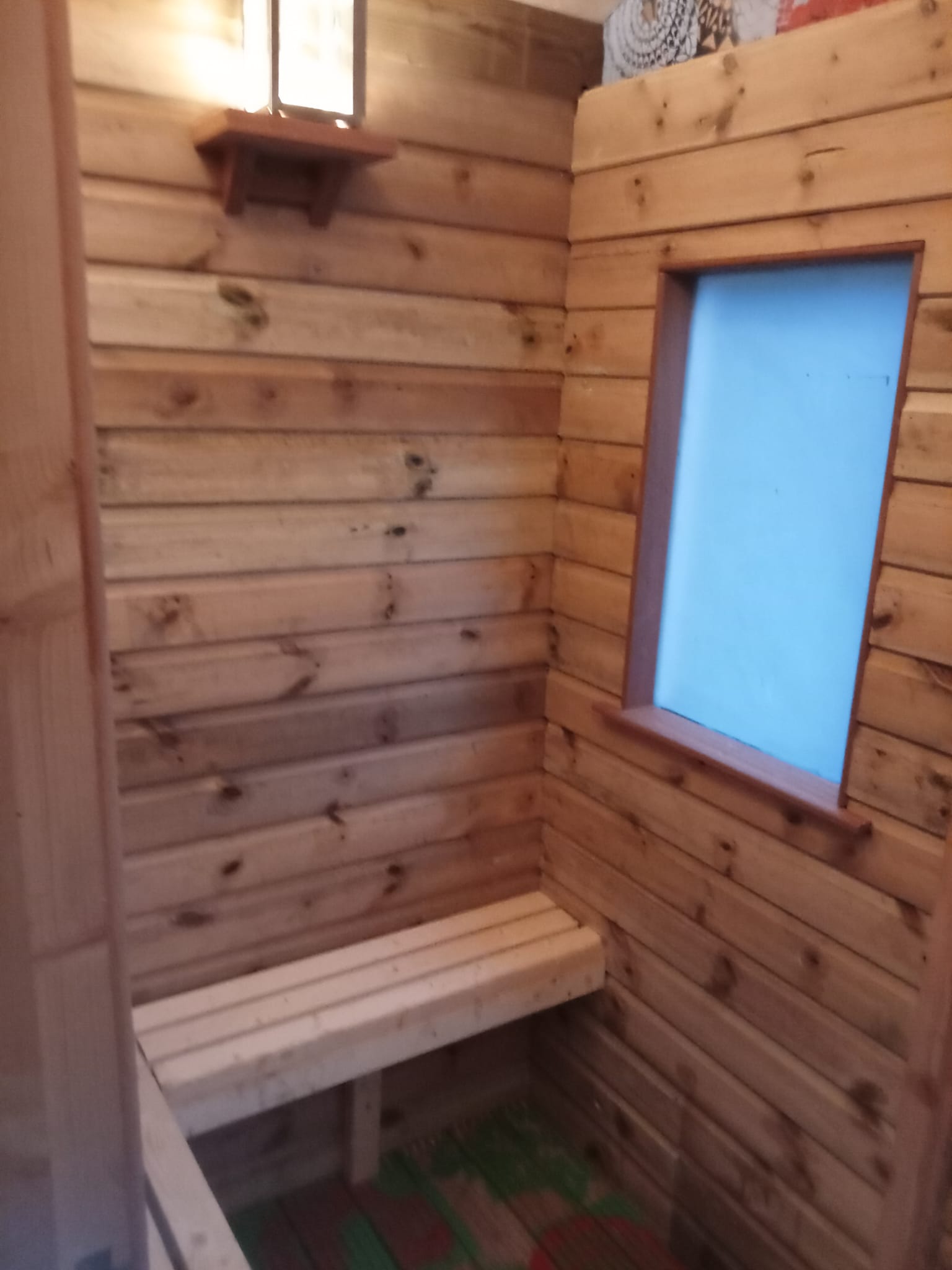 Softly lit changing area inside the OG Sauna Co sauna