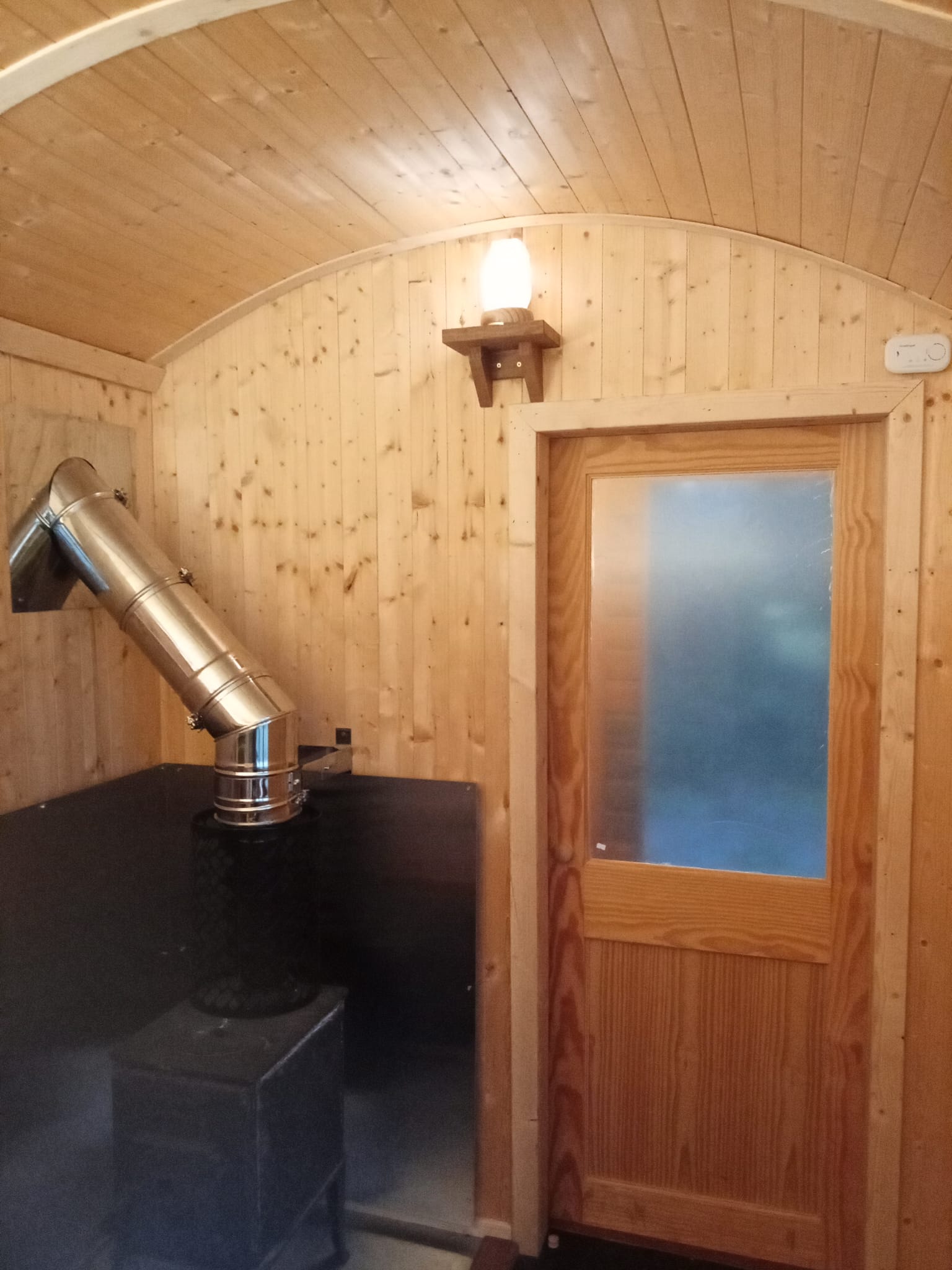 Wood-fired stove area inside the OG Sauna Co sauna